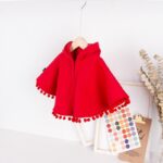 poncho capuche pompons